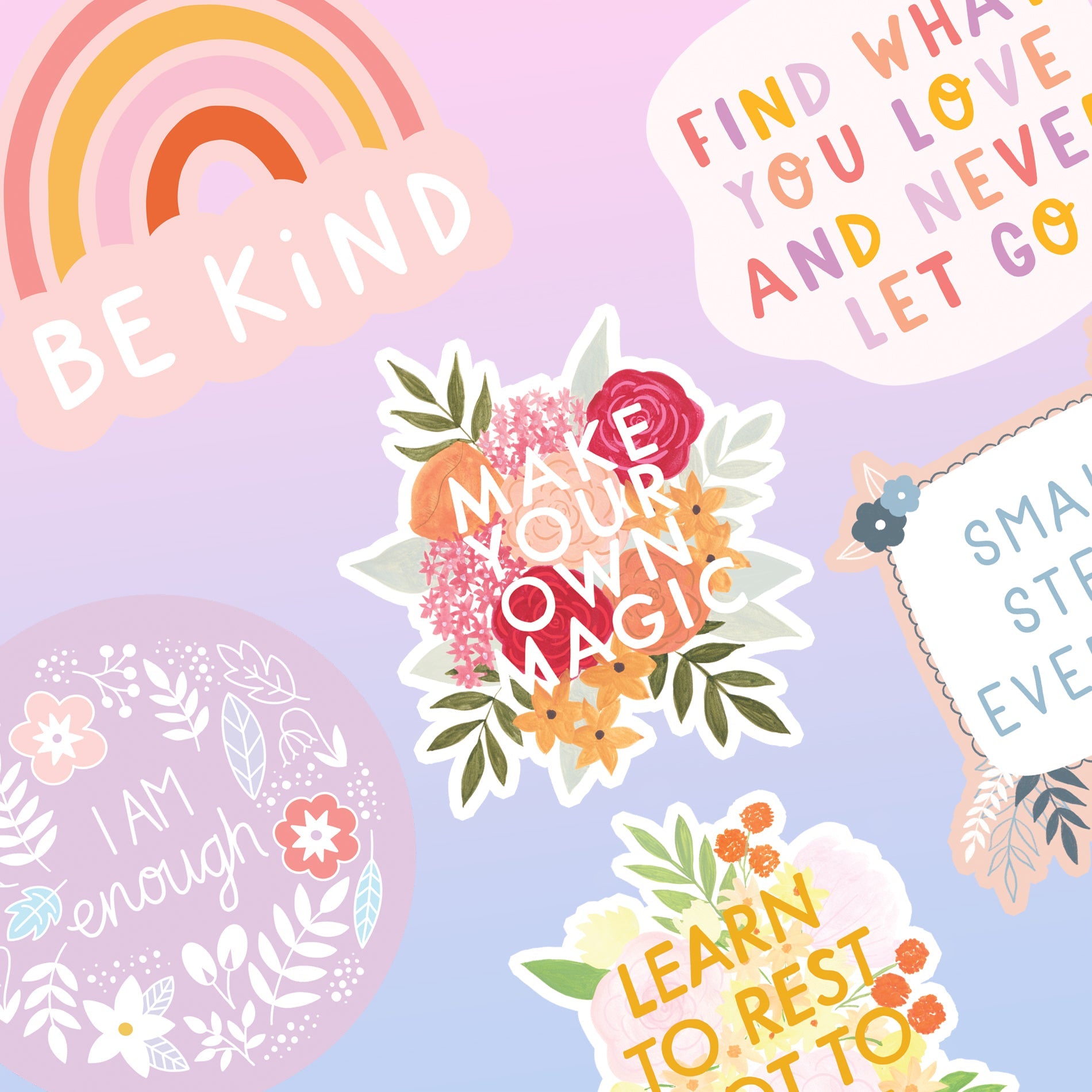 A hand holding a vinyl sticker which says Be Kind underneath a colourful rainbow.